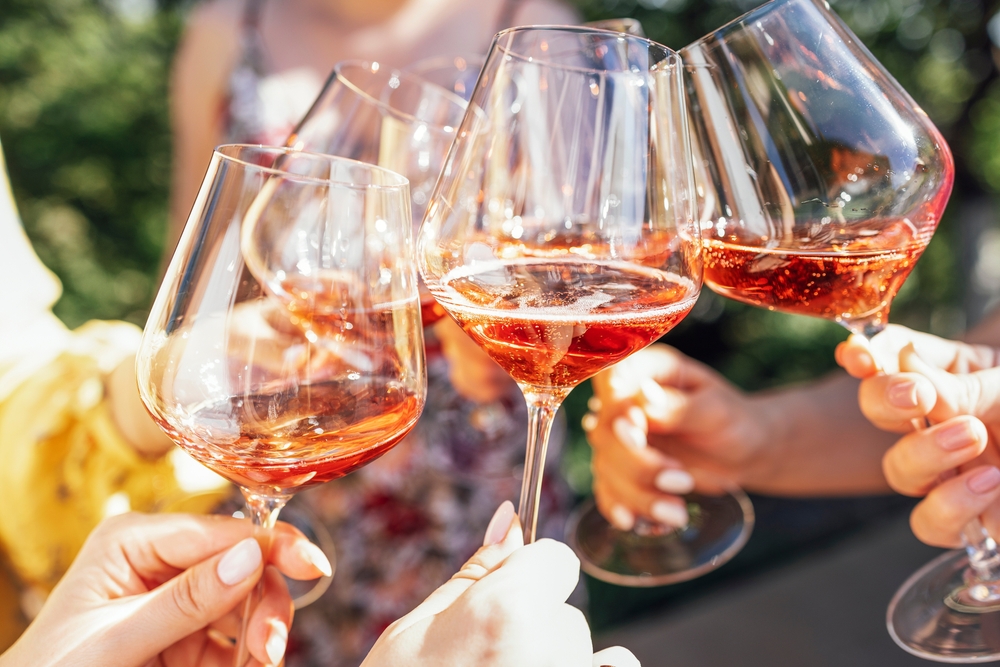 Group of women enjoying wine tasting during their Girlfriend weekend getaway near the Columbia River Gorge