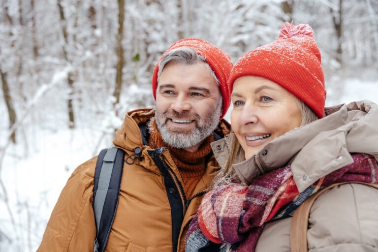 Mature couple enjoying a winter getaway in the snow at our romantic cabins in Washington State