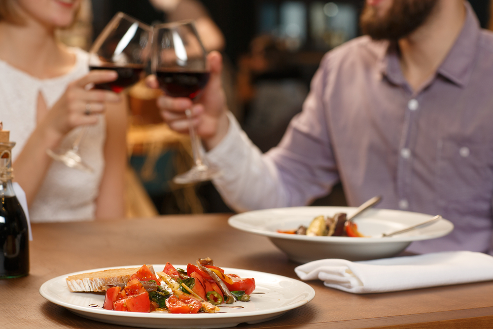 Couple enjoying wine and a romantic meal at the most romantic Stevenson, WA restaurants