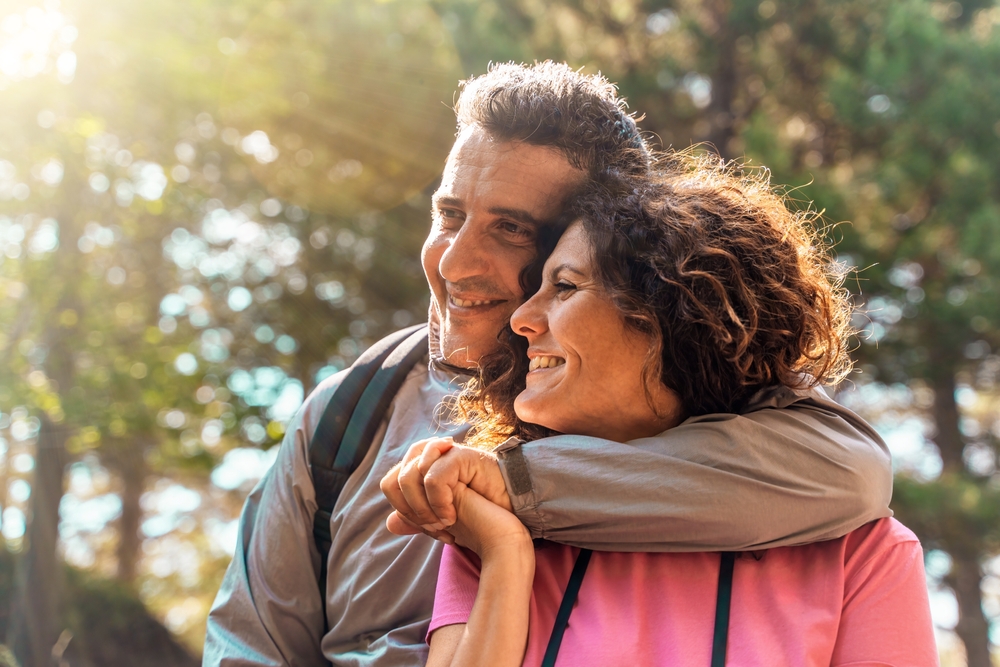 Middle age couple hiking, one of the best things to do near our Cabin getaways